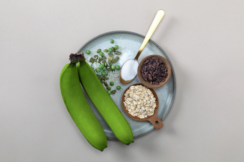 An image of a green banana, oats and healthy foods